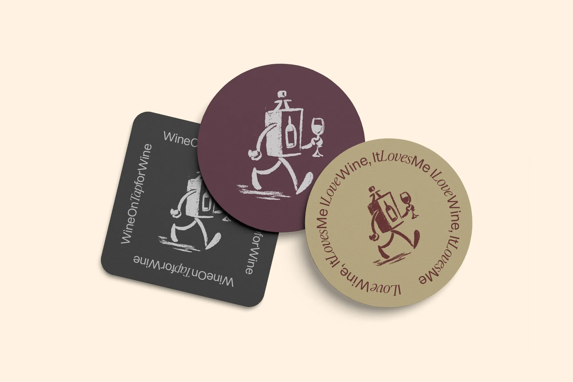 WOOT branded coasters in charcoal, burgundy and tan on a cream surface